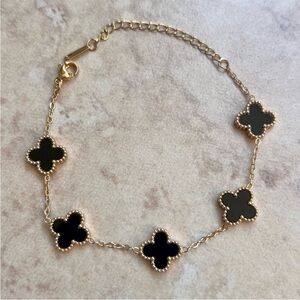 Stainless Steel Gold Four-Leaf Clover Link Bracelet with Black Accents